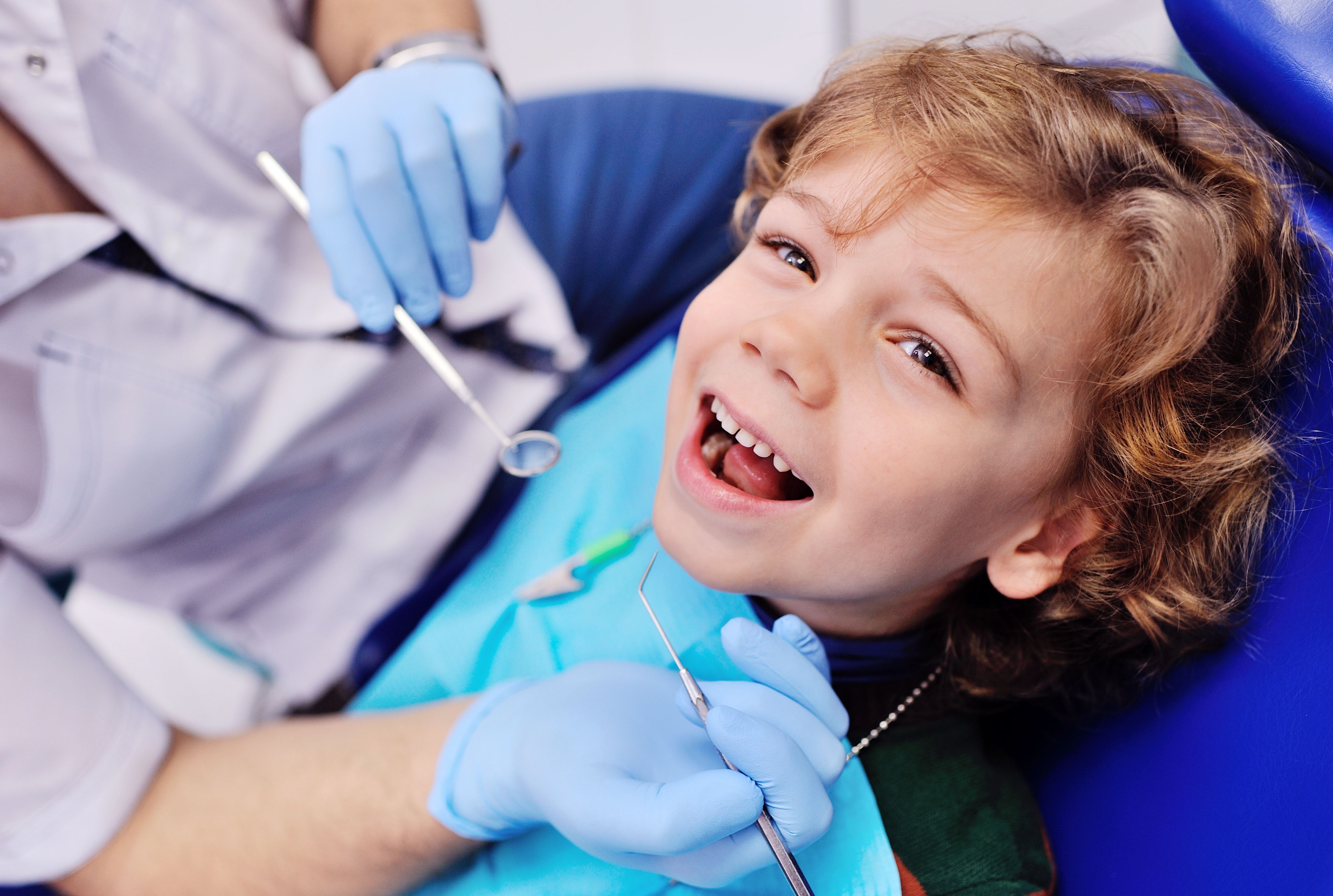 Child sitting in dentist's chair